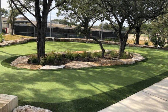 Oakley residential backyard putting green grass